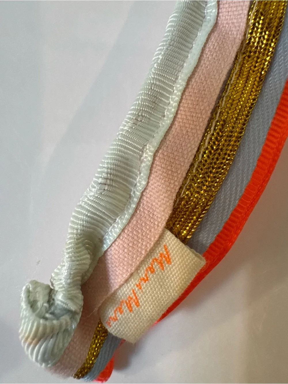 Meri Meri Neon Orange Trim Multicolor Ruffled Headband with metallic gold trim